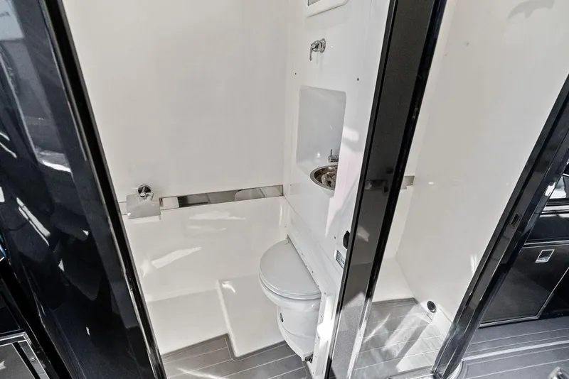 Slide: The Image of Modern bathroom in 2022 Midnight Express 43' Solstice boat, featuring sleek design and compact amenities. - 46