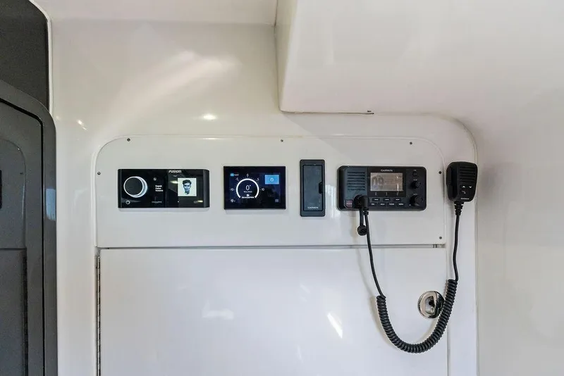 Slide: The Image of Control panel of 2022 Midnight Express 43' Solstice boat with navigation and communication systems. - 47