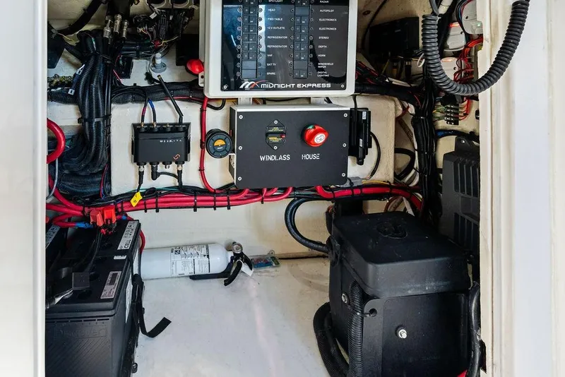 Slide: The Image of Electrical panel and wiring inside a 2022 Midnight Express 43' Solstice boat. - 48