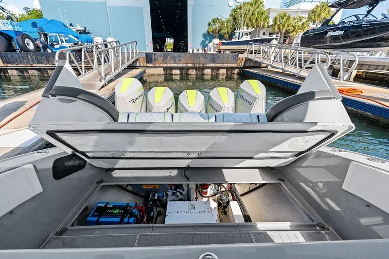 Slide: The Image of 2022 Midnight Express 43' Solstice boat with open engine compartment at marina. - 51
