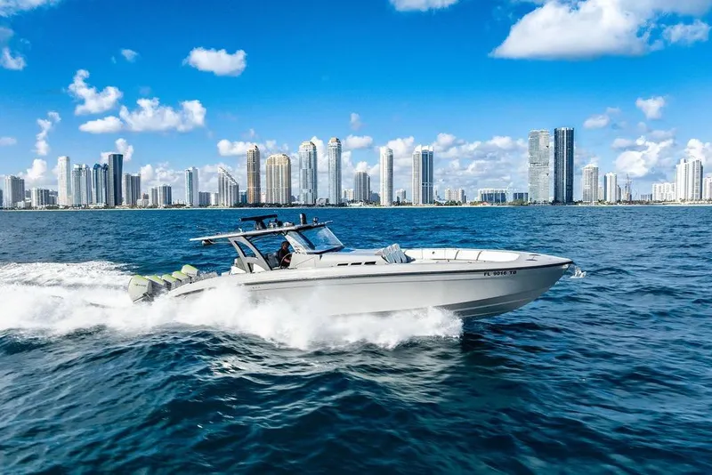 Slide: The Image of 2022 Midnight Express 43' Solstice cruising near city skyline on a sunny day. - 6