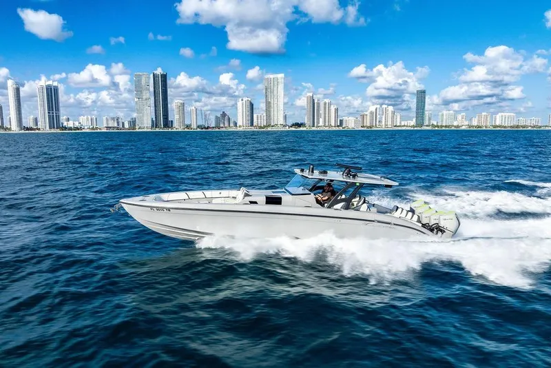 Slide: The Image of 2022 Midnight Express 43' Solstice cruising near city skyline on a sunny day. - 8