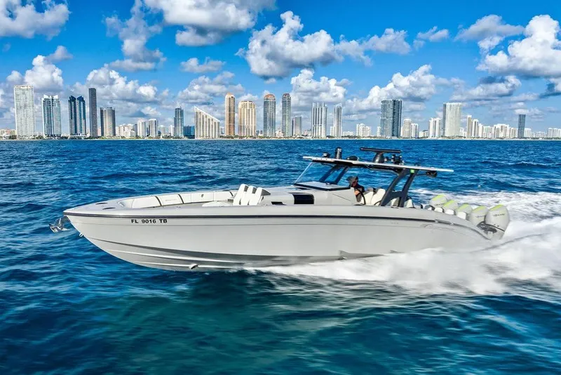 Slide: The Image of 2022 Midnight Express 43' Solstice boat cruising near city skyline on a sunny day. - 9