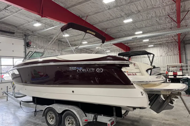 Slide: The Image of 2005 Cobalt 282 boat on trailer in indoor storage facility. - 3