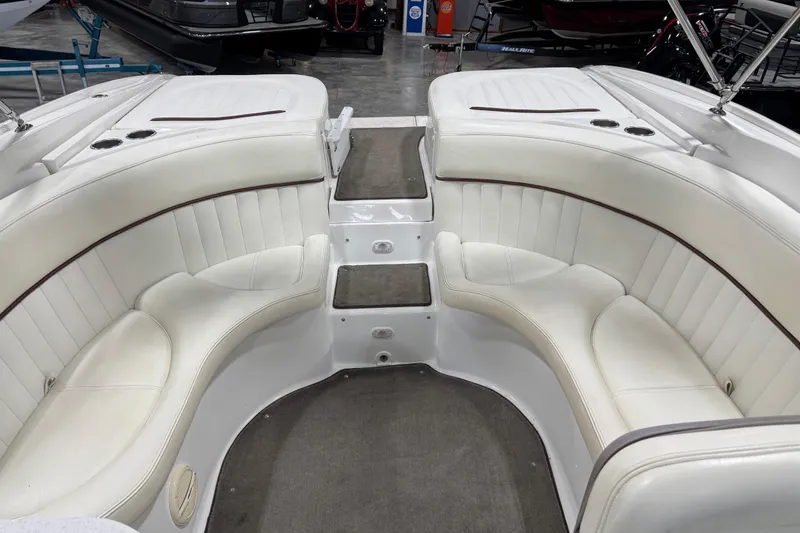 Slide: The Image of Interior of a 2005 Cobalt 282 boat with white leather seating. - 7