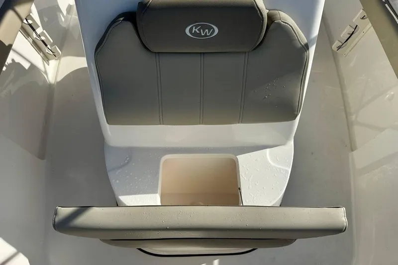 Slide: The Image of 2023 Key West 219 FS boat seat with storage compartment, featuring gray upholstery. - 13