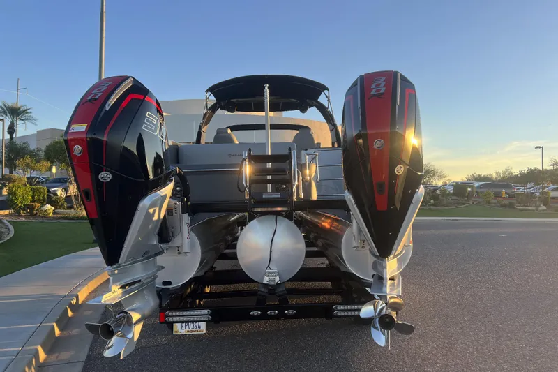 Slide: The Image of 2025 Paradigm 27SST boat with dual outboard engines at sunset. - 5