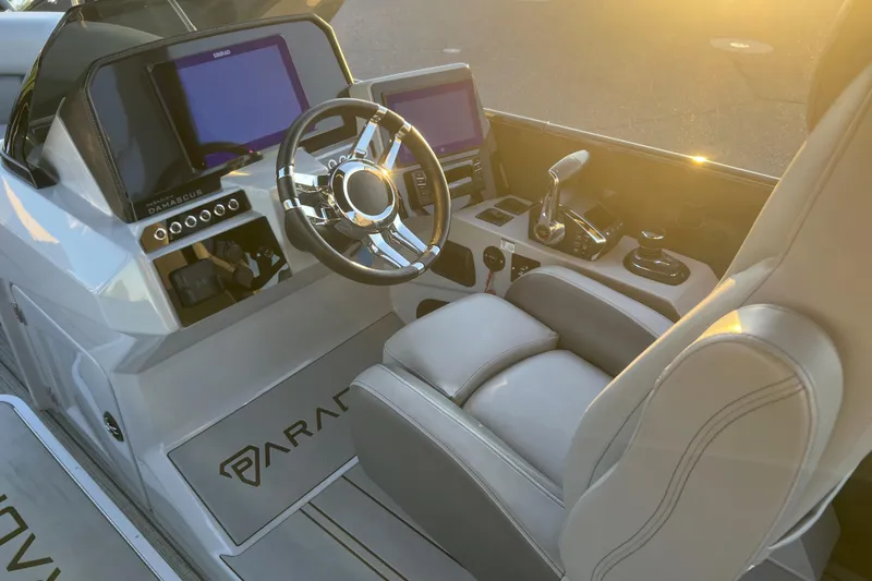 Slide: The Image of Interior of 2025 Paradigm 27SST boat with modern steering and control panels. - 8