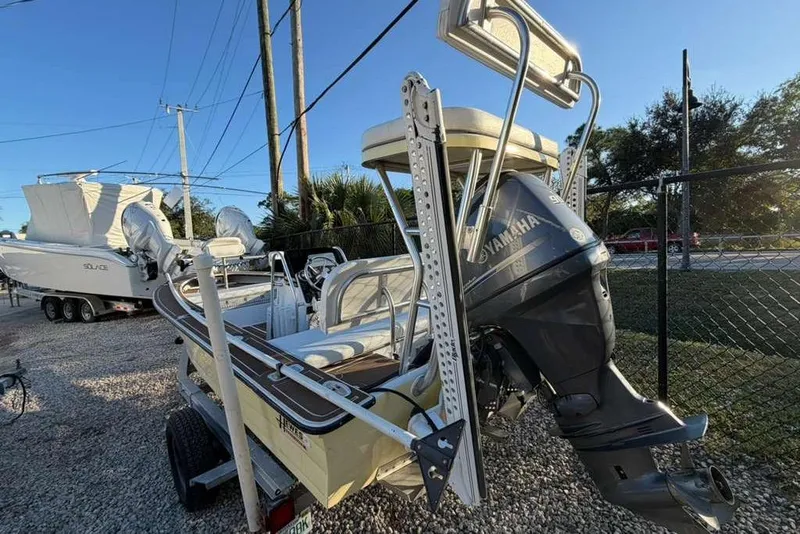 Slide: The Image of 1972 Hewes 17 Bonefisher boat with Yamaha outboard motor on trailer. - 1