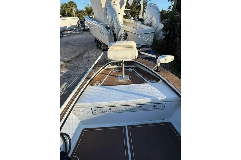 Slide: The Image of 1972 Hewes 17 Bonefisher boat interior with seating and measuring scale. - 8