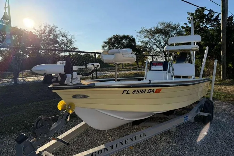 The Image of 1972 Hewes 17 Bonefisher boat on trailer, for sale, parked outdoors. - 0