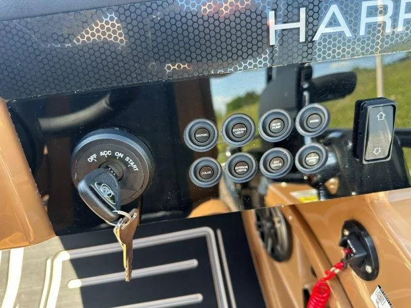 Slide: The Image of Dashboard of 2026 Harris Solstice 230 SL with key switch and controls. - 20