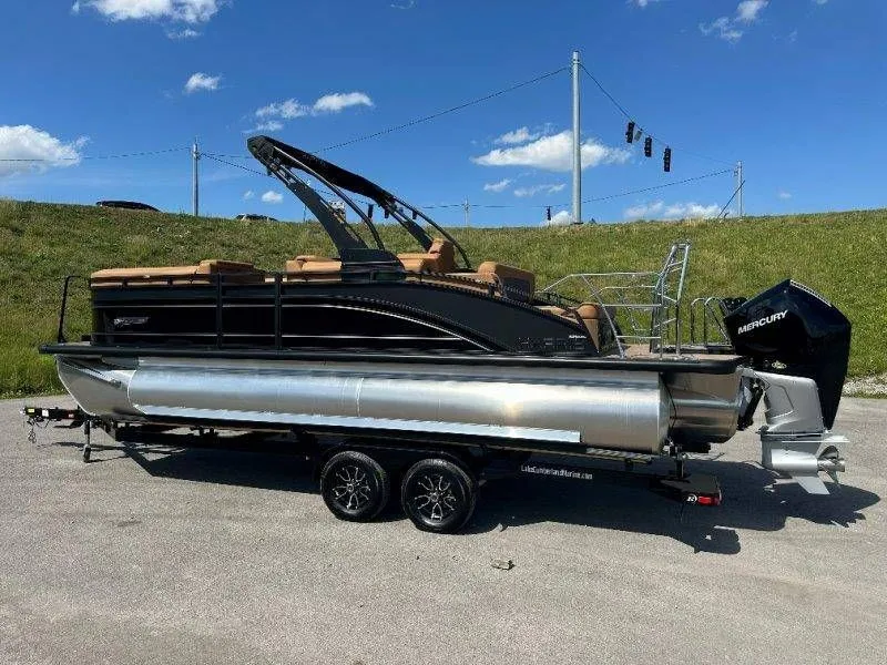 Slide: The Image of 2026 Harris Solstice 230 SL pontoon boat on trailer, sunny day. - 35