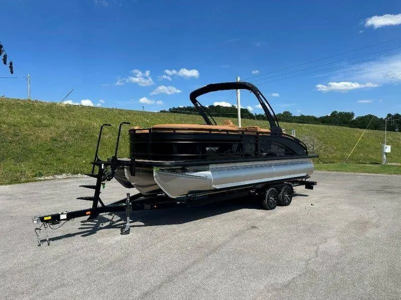 Slide: The Image of 2026 Harris Solstice 230 SL pontoon boat on trailer outdoors. - 37