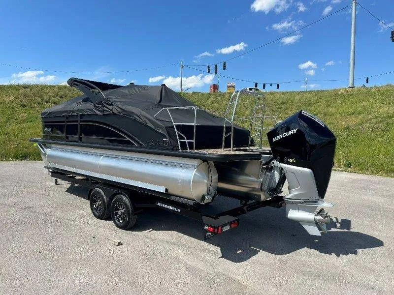 Slide: The Image of 2026 Harris Solstice 230 SL pontoon boat with Mercury engine on trailer. - 48