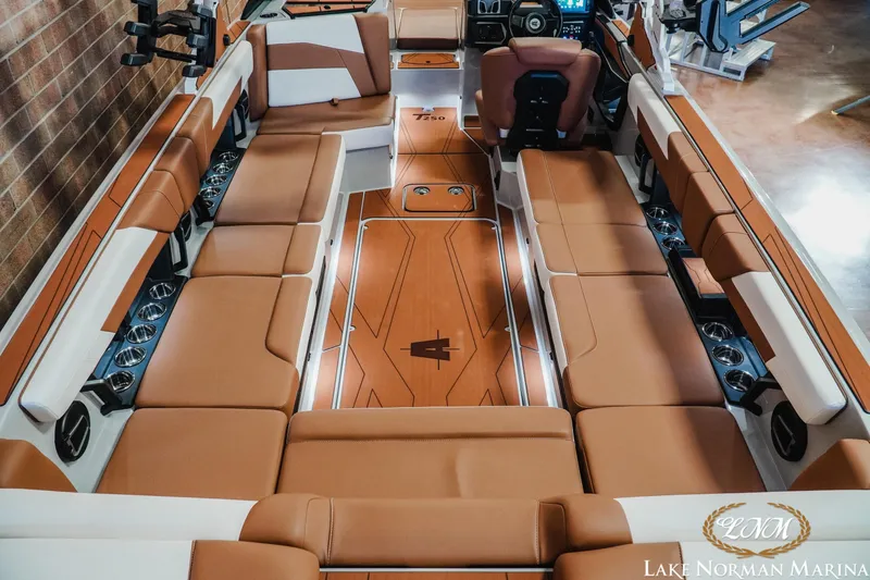 Slide: The Image of Luxurious interior of 2026 Axis T250 boat with brown seating and modern dashboard. - 11