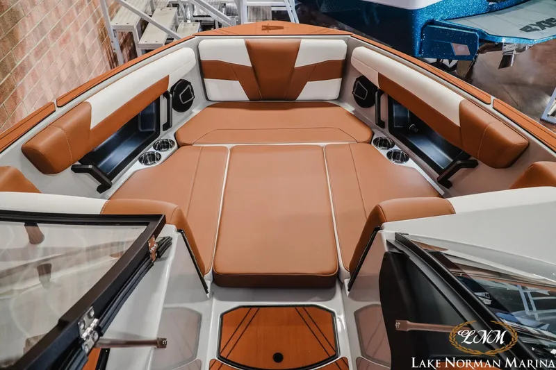 Slide: The Image of Luxurious interior of 2026 Axis T250 boat with brown and white seating at Lake Norman Marina. - 16