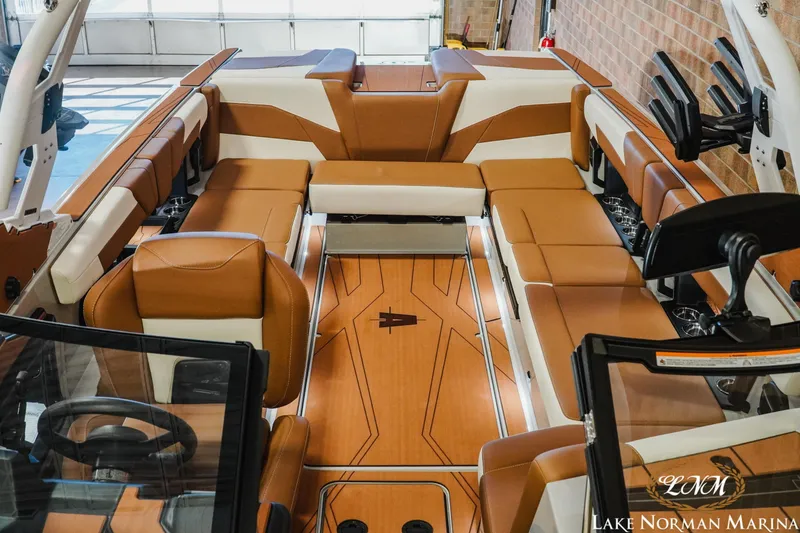 Slide: The Image of Luxurious interior of 2026 Axis T250 boat with tan and white seating. - 17
