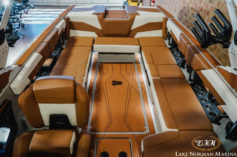 Slide: The Image of Luxurious interior of 2026 Axis T250 boat with brown and white seating at Lake Norman Marina. - 18