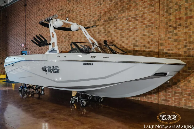 Slide: The Image of 2026 Axis T250 boat displayed indoors at Lake Norman Marina. - 3