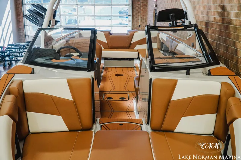 Slide: The Image of 2026 Axis T250 boat interior with tan and white seating at Lake Norman Marina. - 5