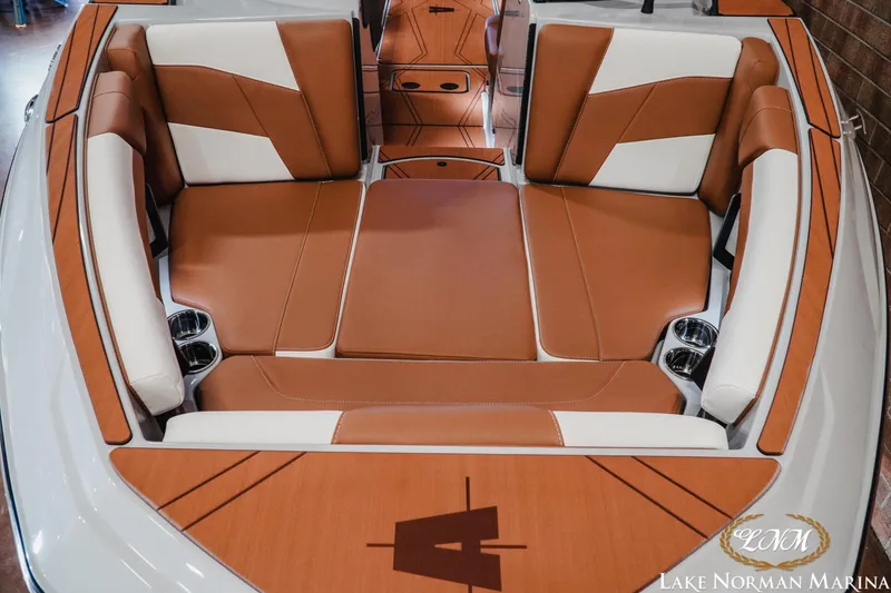Slide: The Image of 2026 Axis T250 boat interior with brown and white seating at Lake Norman Marina. - 6