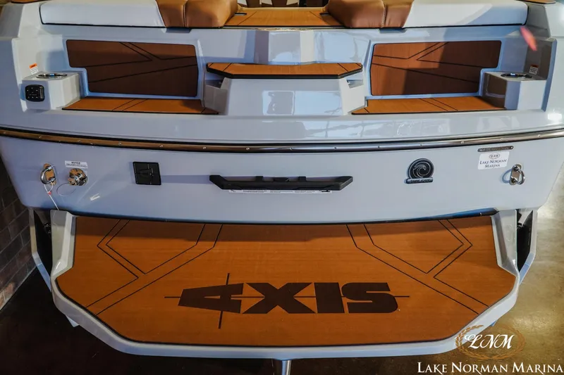 Slide: The Image of 2026 Axis T250 boat rear view with teak deck and seating at Lake Norman Marina. - 9