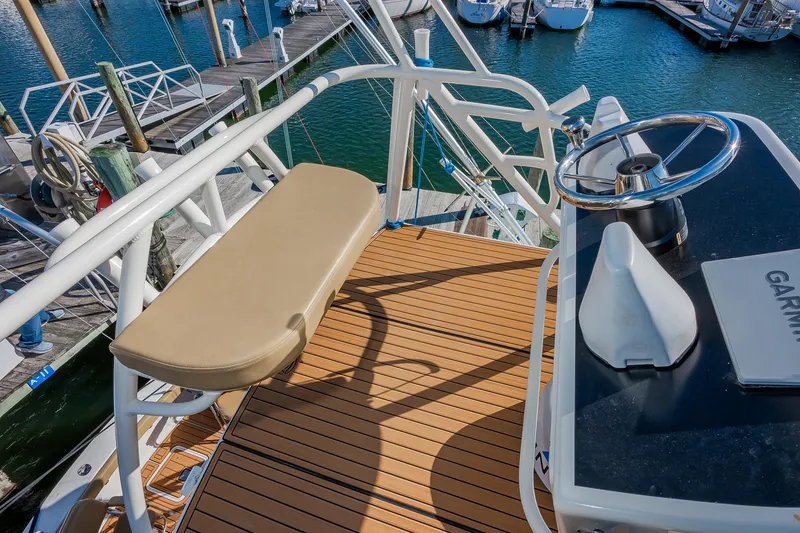 Slide: The Image of Upper deck view of 1987 Custom Carolina Island Boatworks 34 Express at marina. - 16