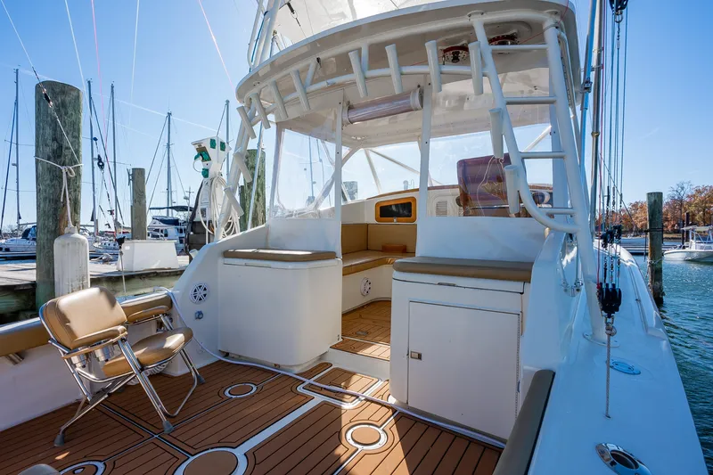 Slide: The Image of 1987 Custom Carolina Island Boatworks 34 Express with teak deck, docked at marina. - 7