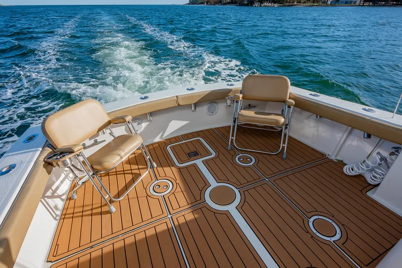 Slide: The Image of 1987 Custom Carolina Island Boatworks 34 Express, featuring spacious deck and comfortable seating. - 9