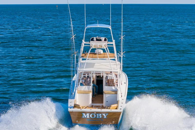 Slide: The Image of 1987 Custom Carolina Island Boatworks 34 Express cruising on open sea. - 3