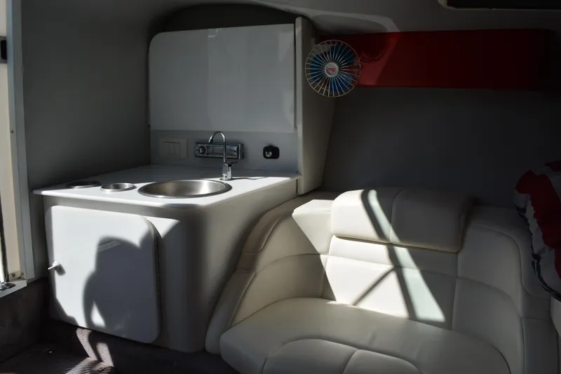 Slide: The Image of Interior of 2000 Formula 271 FASTech boat with sink and seating area. - 12