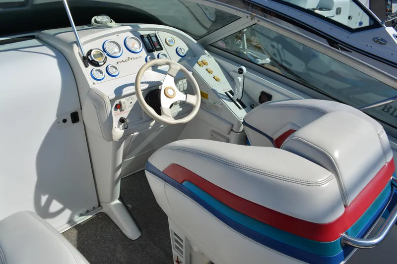 Slide: The Image of Cockpit of 2000 Formula 271 FASTech boat with white and blue dashboard. - 8