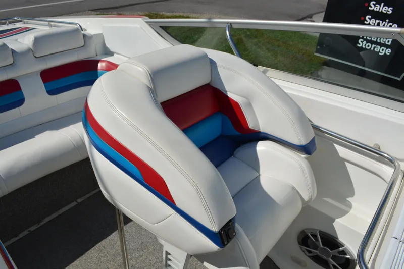Slide: The Image of 2000 Formula 271 FASTech boat interior with white, red, and blue seating. - 9