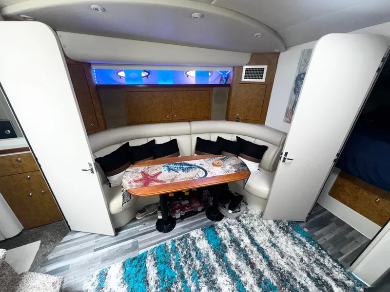 Slide: The Image of Interior of 1998 Cruisers Yachts 3870 Esprit with cozy seating and nautical decor. - 14