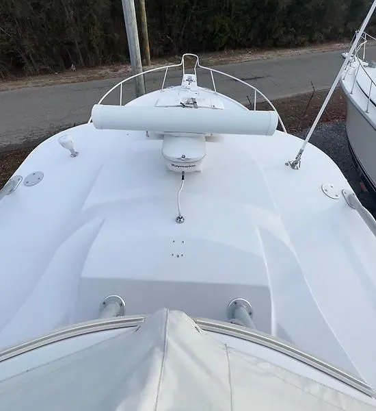 Slide: The Image of 1998 Luhrs 32 Express boat deck with radar and railing, viewed from above. - 12