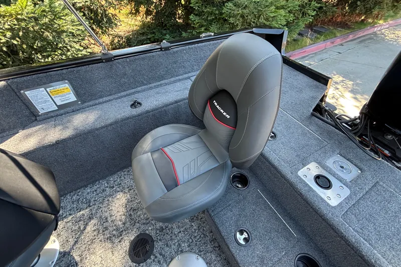 Slide: The Image of 2026 Tracker Pro Guide V-175 WT boat interior with gray seating and carpeted flooring. - 23