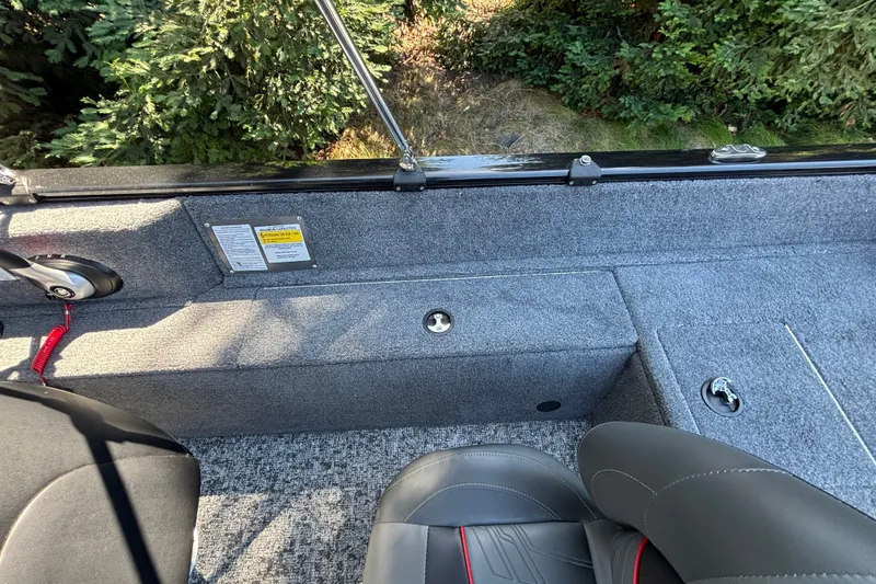 Slide: The Image of Interior view of 2026 Tracker Pro Guide V-175 WT boat with gray carpet and seating. - 37