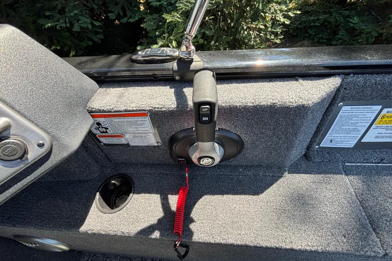 Slide: The Image of Control panel of 2026 Tracker Pro Guide V-175 WT boat with throttle and safety features. - 44