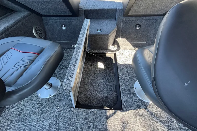 Slide: The Image of 2026 Tracker Pro Guide V-175 WT boat interior with open storage compartment and seating. - 36