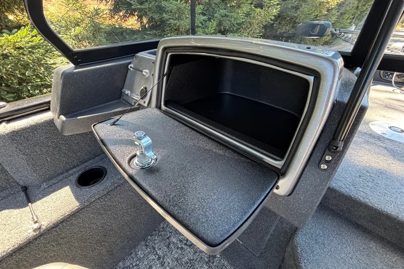 Slide: The Image of 2026 Tracker Pro Guide V-175 WT boat interior storage compartment with open hatch. - 26