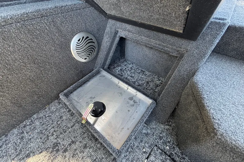 Slide: The Image of Interior of 2026 Tracker Pro Guide V-175 WT boat with speaker and storage compartment. - 47