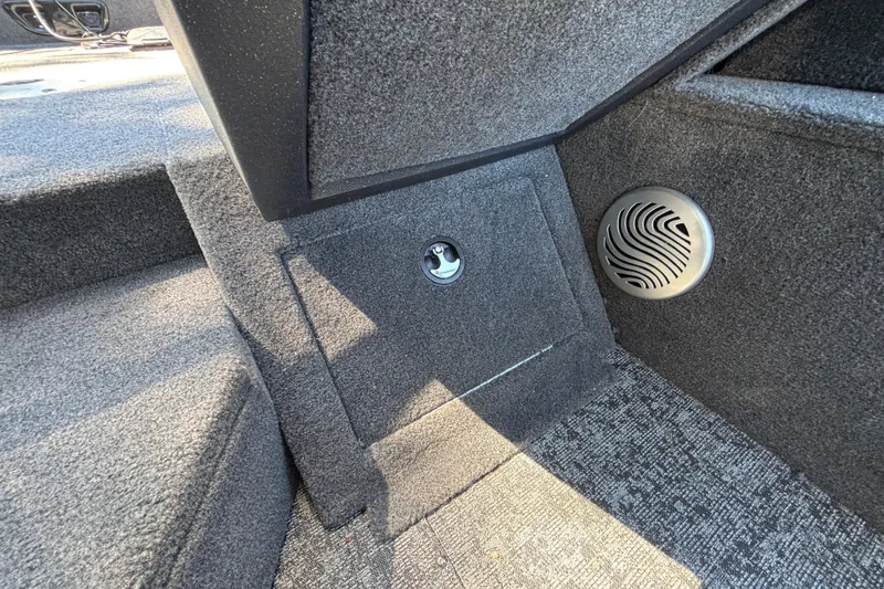 Slide: The Image of Interior of 2026 Tracker Pro Guide V-175 WT boat with speaker and storage compartment. - 49