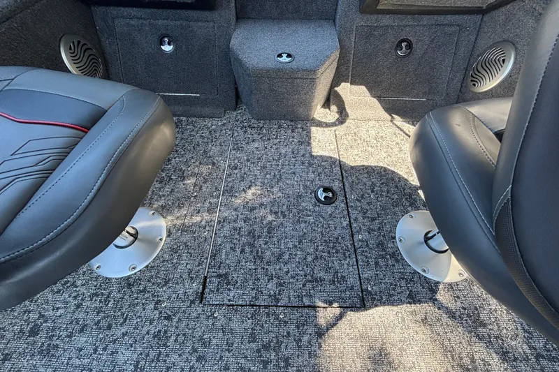 Slide: The Image of Interior of 2026 Tracker Pro Guide V-175 WT boat with carpeted floor and seating. - 50