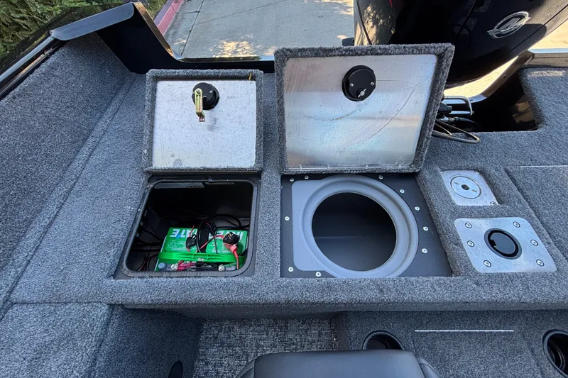 Slide: The Image of 2026 Tracker Pro Guide V-175 WT boat storage compartments with battery and livewell. - 28