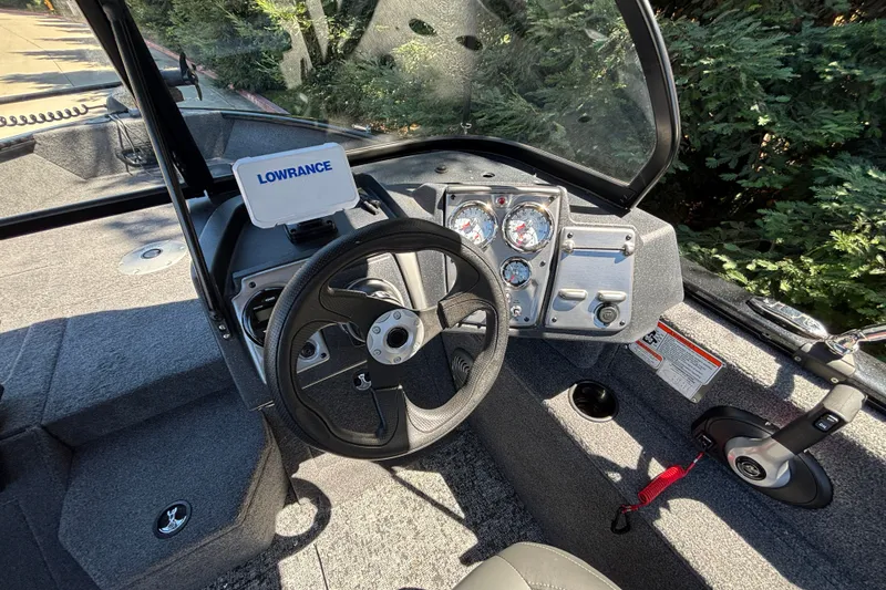 Slide: The Image of 2026 Tracker Pro Guide V-175 WT boat dashboard with Lowrance electronics and steering wheel. - 29