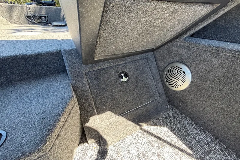 Slide: The Image of Interior of 2026 Tracker Pro Guide V-175 WT boat with speaker and storage compartment. - 46
