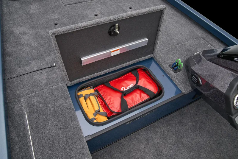Slide: The Image of 2026 Ranger RT178C boat interior with blue-accented seats and steering wheel in showroom. - 17