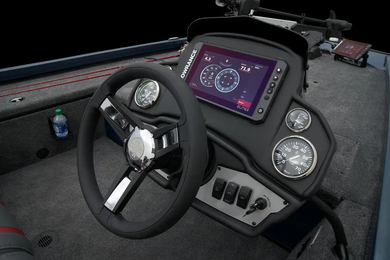 Slide: The Image of 2026 Ranger RT178C boat with Mercury outboard motor displayed indoors. - 23