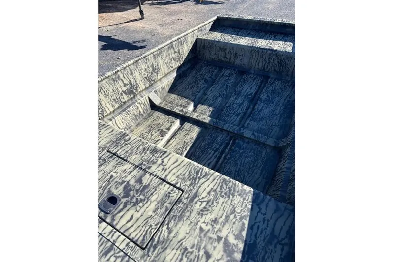 Slide: The Image of 2026 Tracker Grizzly 15 Jon boat interior with camouflage pattern. - 4